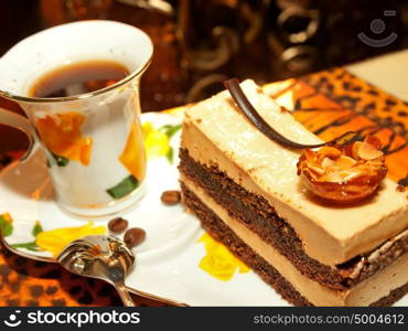 Vienna cake with almond and caramel in cafe