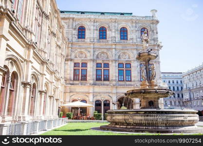 Vienna Opera house, Austria. Photo view on fountain and statue at vienna opera state house.. Vienna Opera house, Austria. Photo view on fountain at vienna opera state house.