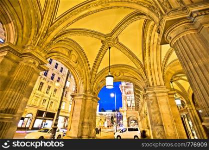 Vienna state Opera house arcades and evening street view, capital of Austria