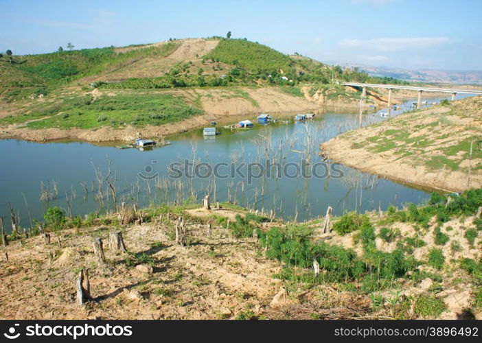 Vietnam countryside landscape, impression chain of mountain cover Nam Ka lake, bare hill from deforestation, amazing scene with floating house on river, residential on water