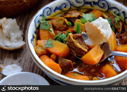 Vietnam food, bread with stewed beef, a popular meal at morning, eat attach parsley, basil, lemon pepper and salt make so delicious taste