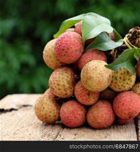 Vietnam fruit, litchi or lychee, a tropical fruits that delicious, sweet at Bac Giang, bunch of vai thieu on green background