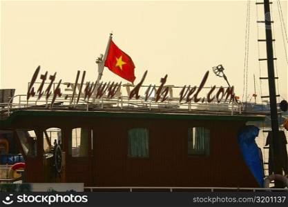Vietnamese flag on a boat, Halong Bay, Vietnam