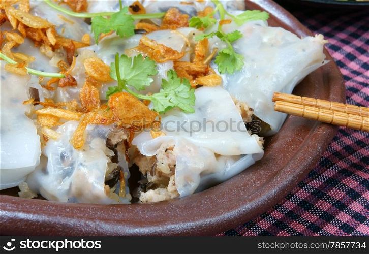 Vietnamese food, Banh Cuon name Rice noodle roll or rolled cake, is made from rice batter filled with mushroom, pork, served with Vietnam pork sausage, sliced cucumber, bean sprouts and sauce