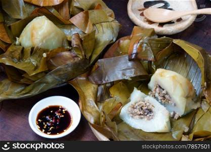 Vietnamese food, Banh Gio or pyramid shaped rice dough dumpling filled with pork, shallot, andwood ear mushroomwrapped in banana leaf, is delicious street food, diet food make from rice flour