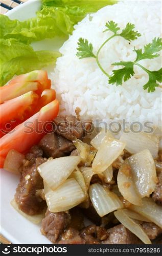Vietnamese food, bo luc lac, nutrition and delicious eating, beef fry with spice, onion, garlic, eat with salad, tomato, cooked rice