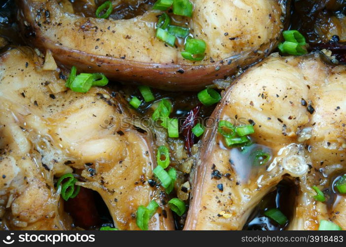 Vietnamese food, ca kho to or fish cook with sauce, caramel fish, a Asian eating, raw material as fresh water fish, onion, garlic, pepper, this meal vey nutrition, delicious