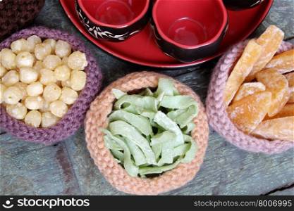 Vietnamese food for Tet holiday in spring, jam is traditional food on lunar new year, can make from sweet potato, lotus seed, ginger with sugar, colorful background for Vietnam custom