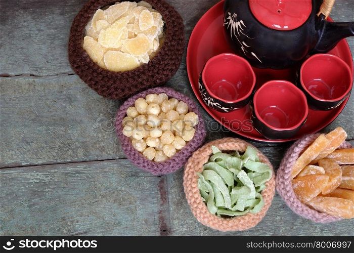 Vietnamese food for Tet holiday in spring, jam is traditional food on lunar new year, can make from sweet potato, lotus seed, ginger with sugar, colorful background for Vietnam custom