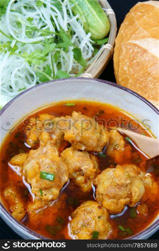 Vietnamese food, meatball, make from ground meat, delicious, popular street food or Vietnam meal, season with vegetable as: cucumber, scallion, papaya and bread. This dish process by Dalat style