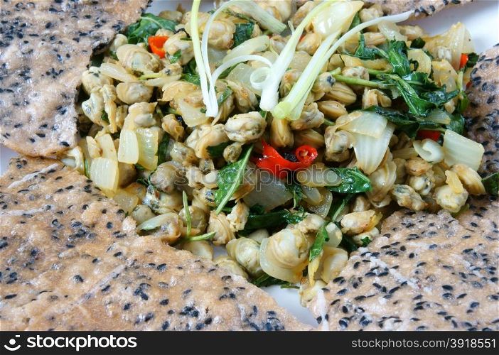 Vietnamese food, mussel fry with rice paper, a speciality of Hue eating, a Vietnam snack, raw material as mussel, laksa leaves, chili, pepper, onion, spice, garlic