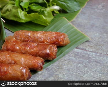 Vietnamese food, spring roll or cha gio, a delicious fried food with cylinder shape, eat with bun, salad and fish sauce, this also rich calories, cholesterol, fatty food, popular Vietnam eating