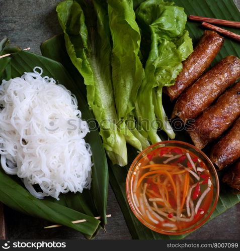 Vietnamese food, spring roll or cha gio, a delicious fried food with cylinder shape, eat with bun, salad and fish sauce, this also rich calories, cholesterol, fatty food, popular Vietnam eating