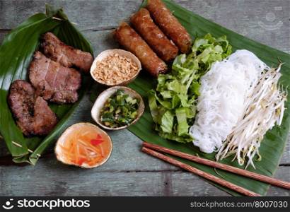 Vietnamese food, spring roll or cha gio, roast meat , a delicious fried food, eat with bun, salad and fish sauce, this also rich calories, cholesterol, fatty food, popular Vietnam eating