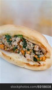 Vietnamese Sandwich with minced pork , carrot and spring onion (Banh Mi)