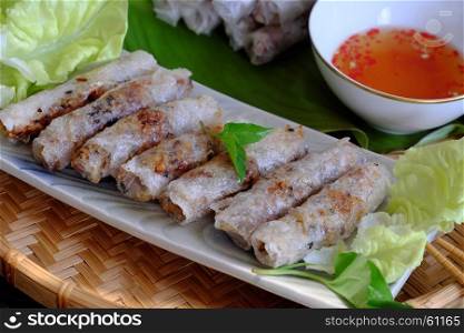 Vietnamese spring roll pastry or cha gio is popular food at Vietnam cuisine, stuffing from meat and wrapper by rice paper, then deep fried, eat with salad and fish sauce