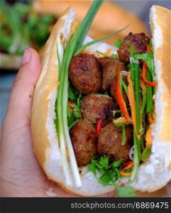 Vietnamese street food, banh mi thit nuong or Vietnam bread from grilled meat, this is popular eating and special culture in Viet Nam cuisine