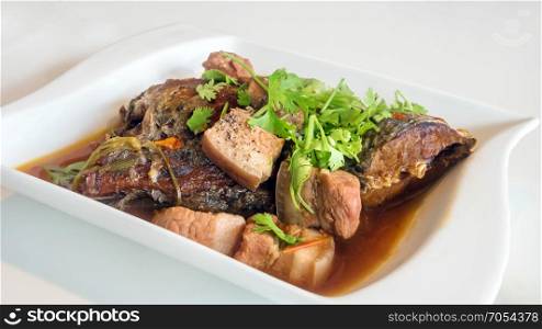 vietnamese style food. stewed pork and fish with herb , vietnamese style food