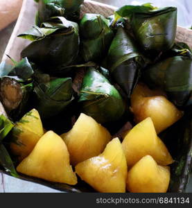 Vietnamese traditional food for may 5th, is double five festival or tet doan ngo, sticky rice cake in green leaf, also call banh u tro with pyramidal shape