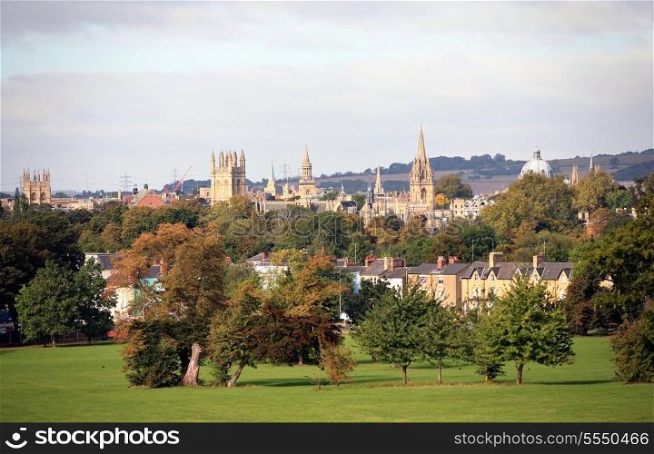 View across a park to the famous university spires of Oxford, England, in autumn
