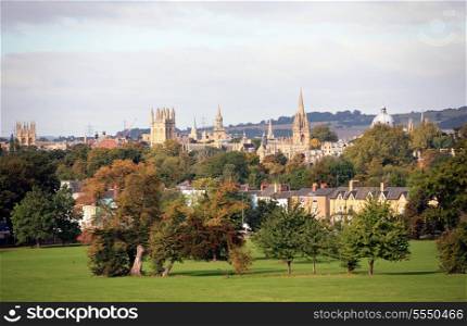 View across a park to the famous university spires of Oxford, England, in autumn