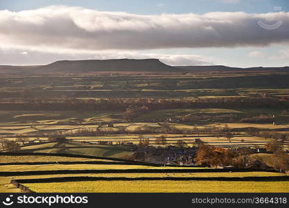 View across fields towards Pen-y-Ghent in Yorkshire Dales National Park