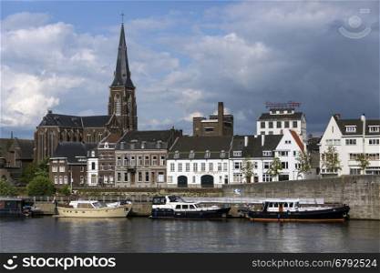 View across the River Meuse to part of the city of Maastricht in southeast Netherlands. Maastricht is an industrial city and capital of the province of Limburg. It is situated on both sides of the River Maas near the Belgian and German borders.