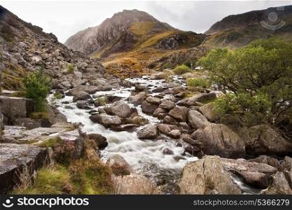 View along and up Ogwen Falls towards Tryfan mountain peak in Snowdonia National Park