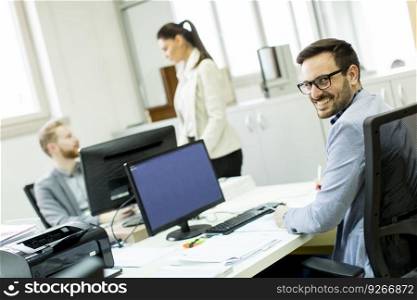View at Business partners working in modern office