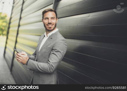 View at businessmen entrepreneur using mobile phone outdoor