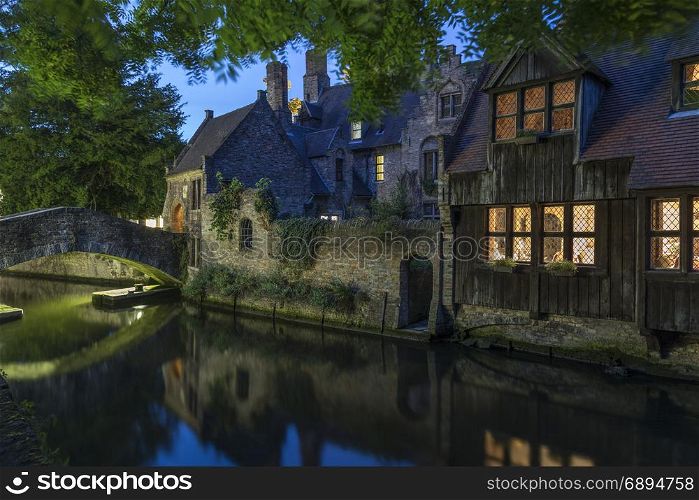 View at dusk of one of the many canals in the city of Bruges in Belgium. The historic city center is a UNESCO World Heritage Site