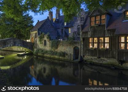 View at dusk of one of the many canals in the city of Bruges in Belgium. The historic city center is a UNESCO World Heritage Site