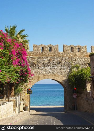 View at mediterranean sea through the Milon gate of Rhodes old town, Greece