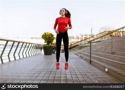 View at pretty young woman exercising outside