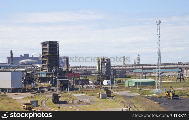 View at steel factory with blue sky