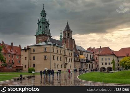 View at Wavel square with medieval buildings during a rainy day in Krakow, Poland. View at Wavel square with medieval buildings in Krakow, Ppland