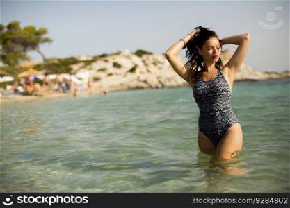 View at woman standing in the sea water