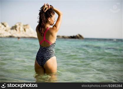 View at woman standing in the sea water