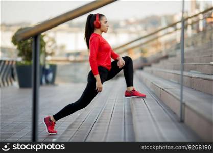 View at young woman exercising on a outdoor stairs