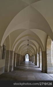 view down a long beautiful and old corridor