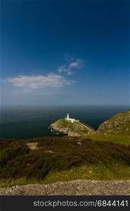 View down on South Stack light house on sunny morning. Anglesey, North Wales, United Kingdom.