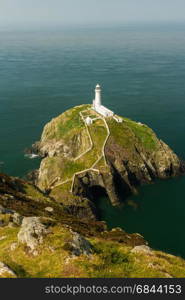 View down on South Stack light house on sunny morning. Anglesey, North Wales, United Kingdom.