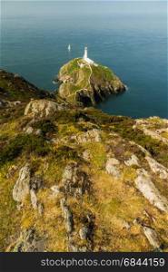 View down on South Stack light house on sunny morning. Anglesey, North Wales, United Kingdom.