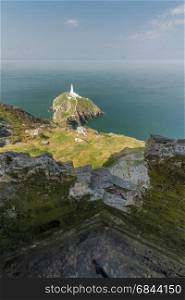 View down on South Stack light house on sunny morning from WWII coastal observation post South Stack. Anglesey, North Wales, United Kingdom.