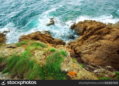 View down the cliffs at Atlantic ocean coast in Brittany, France