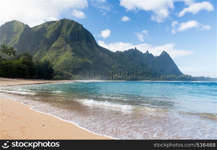 View down the sand at Tunnels Beach in winter on Hawaiian island of Kauai on North Shore. Tunnels beach north shore Kauai