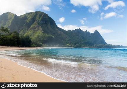 View down the sand at Tunnels Beach in winter on Hawaiian island of Kauai on North Shore. Tunnels beach north shore Kauai