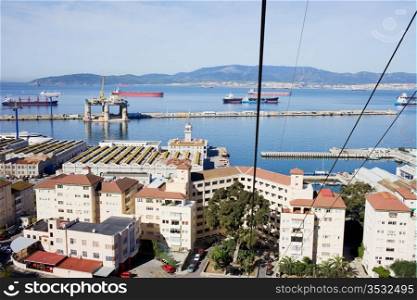 View from a cable car on an urban scenery of Gibraltar town and bay.
