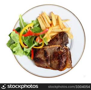 View from above of a meal of T-bone steak, salad and french fries