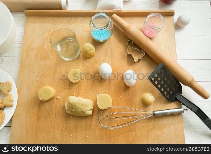 View from above on kitchen utensils and dough